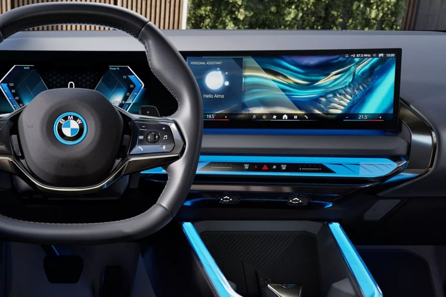 BMW steering wheel and large curved display screen in a modern car interior.