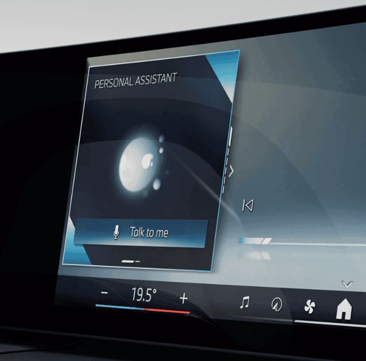 Car dashboard screen displaying a "Personal Assistant" interface with a "Talk to me" button.